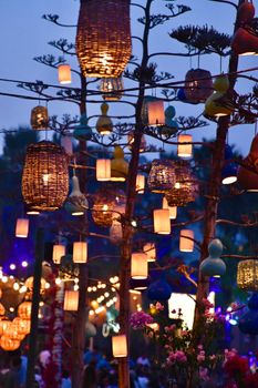 Vibrant outdoor festival with colorful lanterns and twilight ambiance.