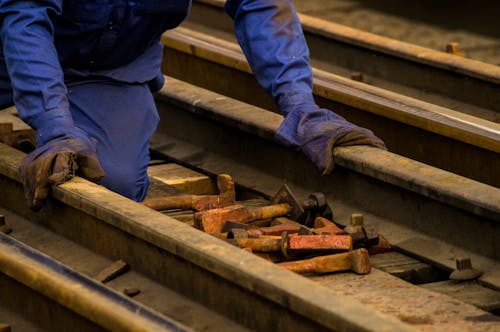 Man Working with Railway Tracks