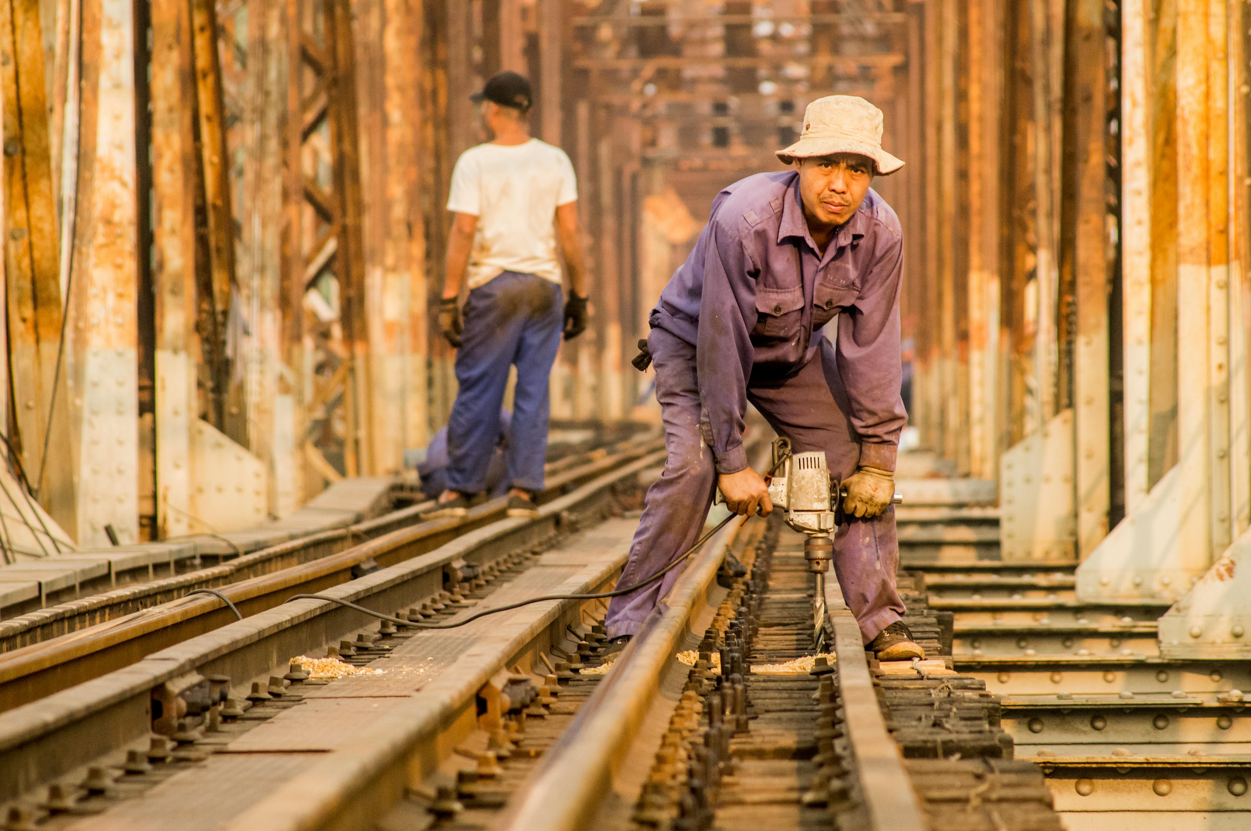 Person using remote to change channels on tv