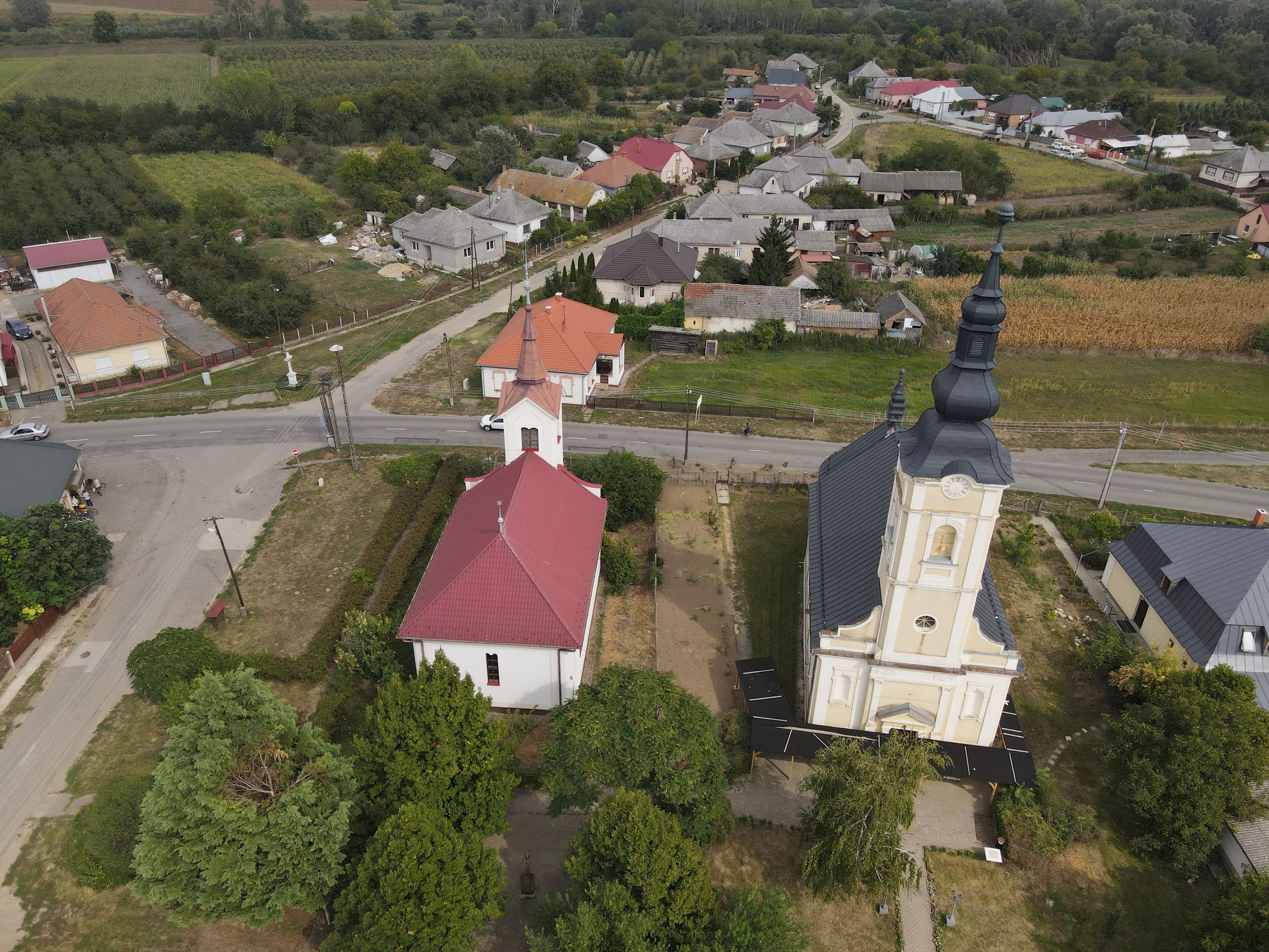 Aerial view of Aranyosapáti village featuring a church with red roof. Hungary