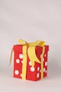 Vibrant Red Gift Box with Yellow Ribbon