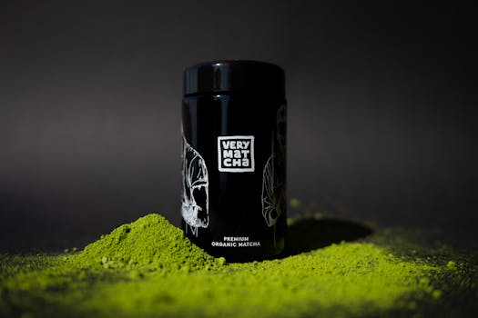 Photo of premium organic matcha with black packaging against a dark background.