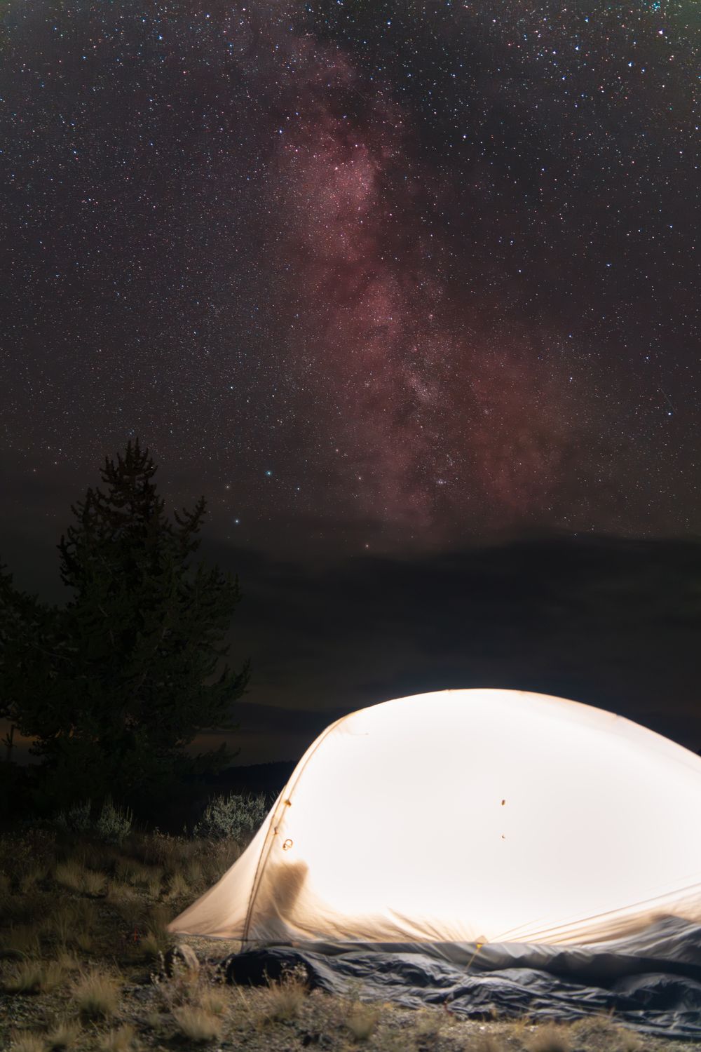 Camping under a bright starry night sky