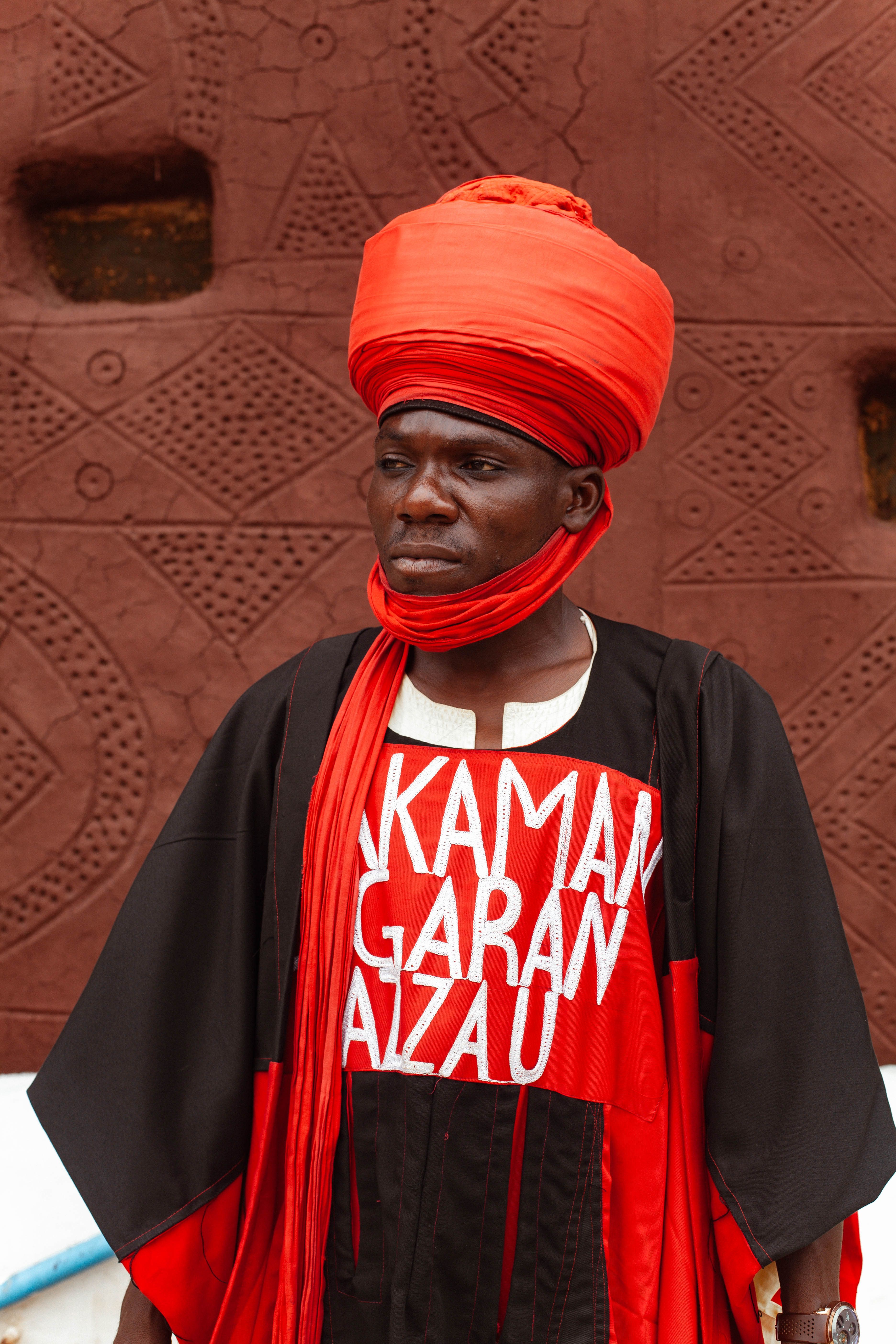 Man in vibrant traditional attire from Northern Nigeria showcasing cultural heritage.