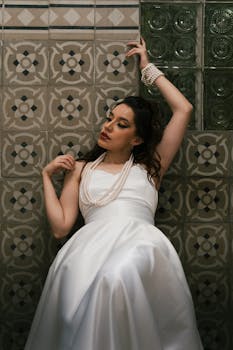 Stunning bridal portrait featuring elegant style against Mexican tile backdrop.