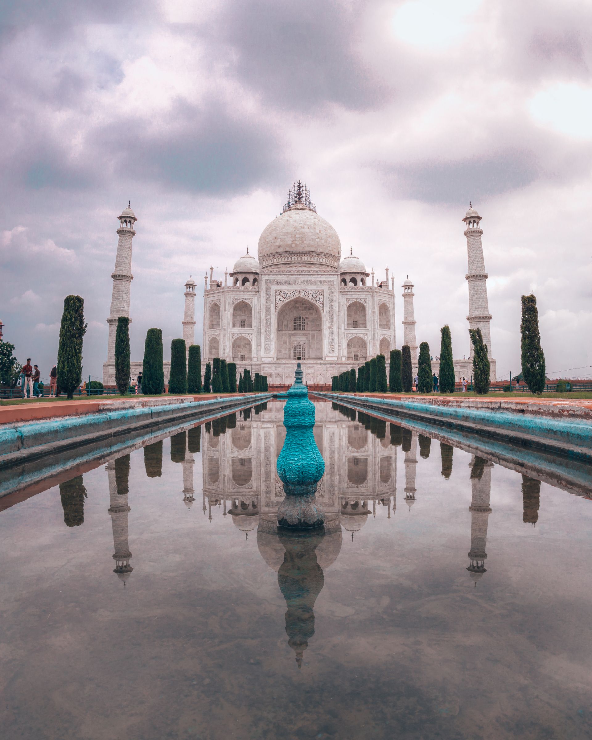 A cinematic view across India — golden light over a heritage monument, evoking the country's iconic destinations