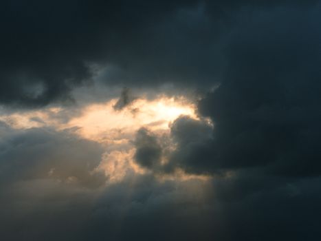 Captivating clouds illuminated by sunlight during the golden hour over Scotland.