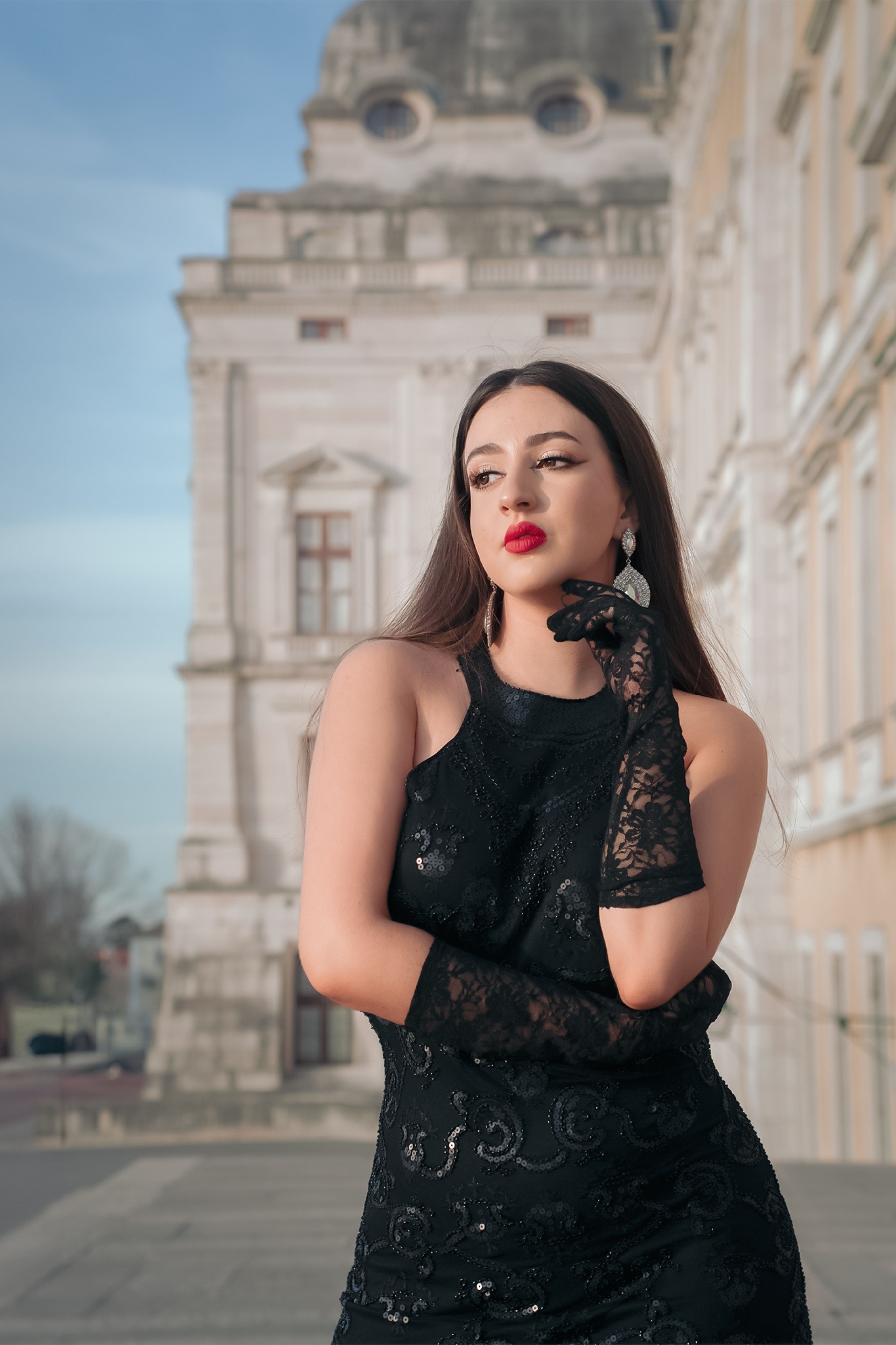 Elegant Woman in Black Dress at Historic Building · Free Stock Photo