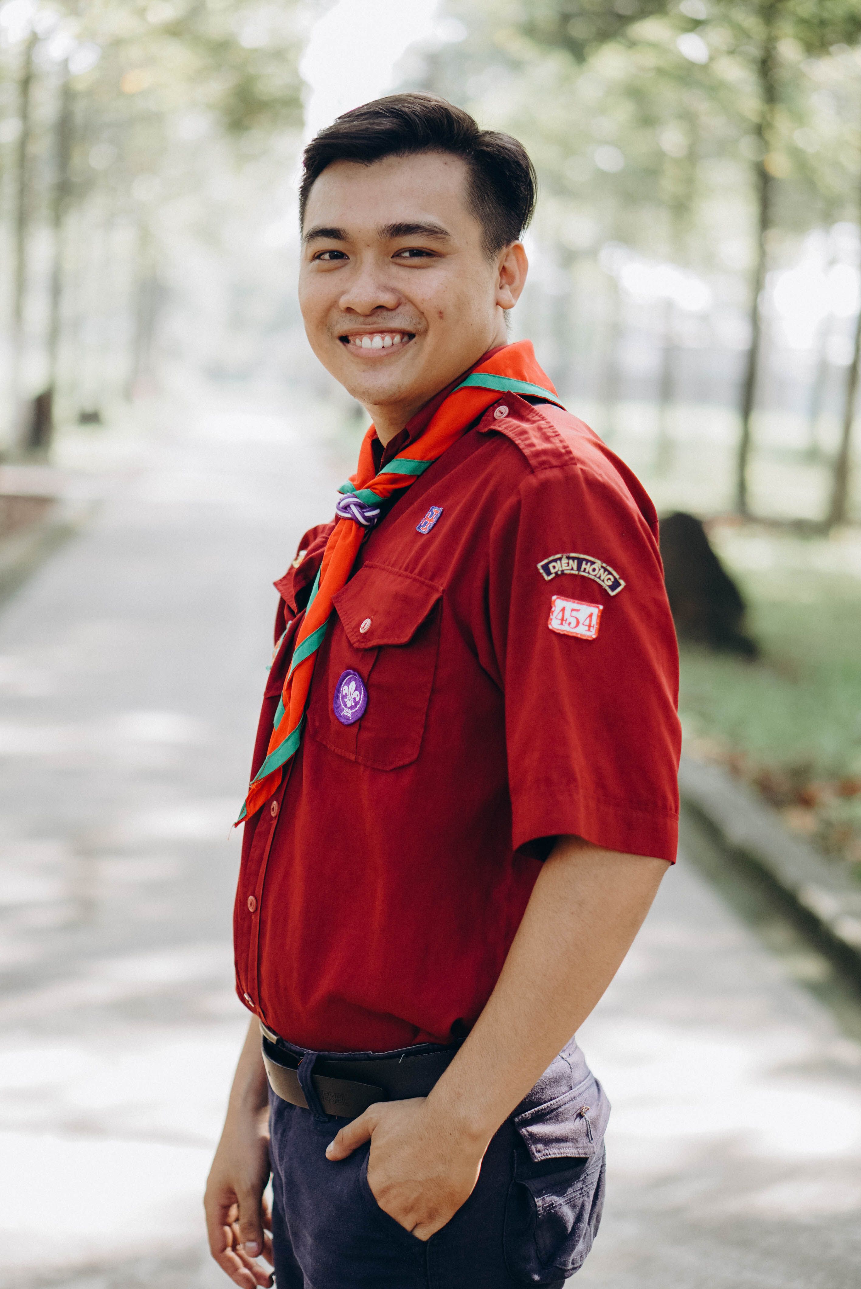 Young Scout Smiling Outdoors in Uniform