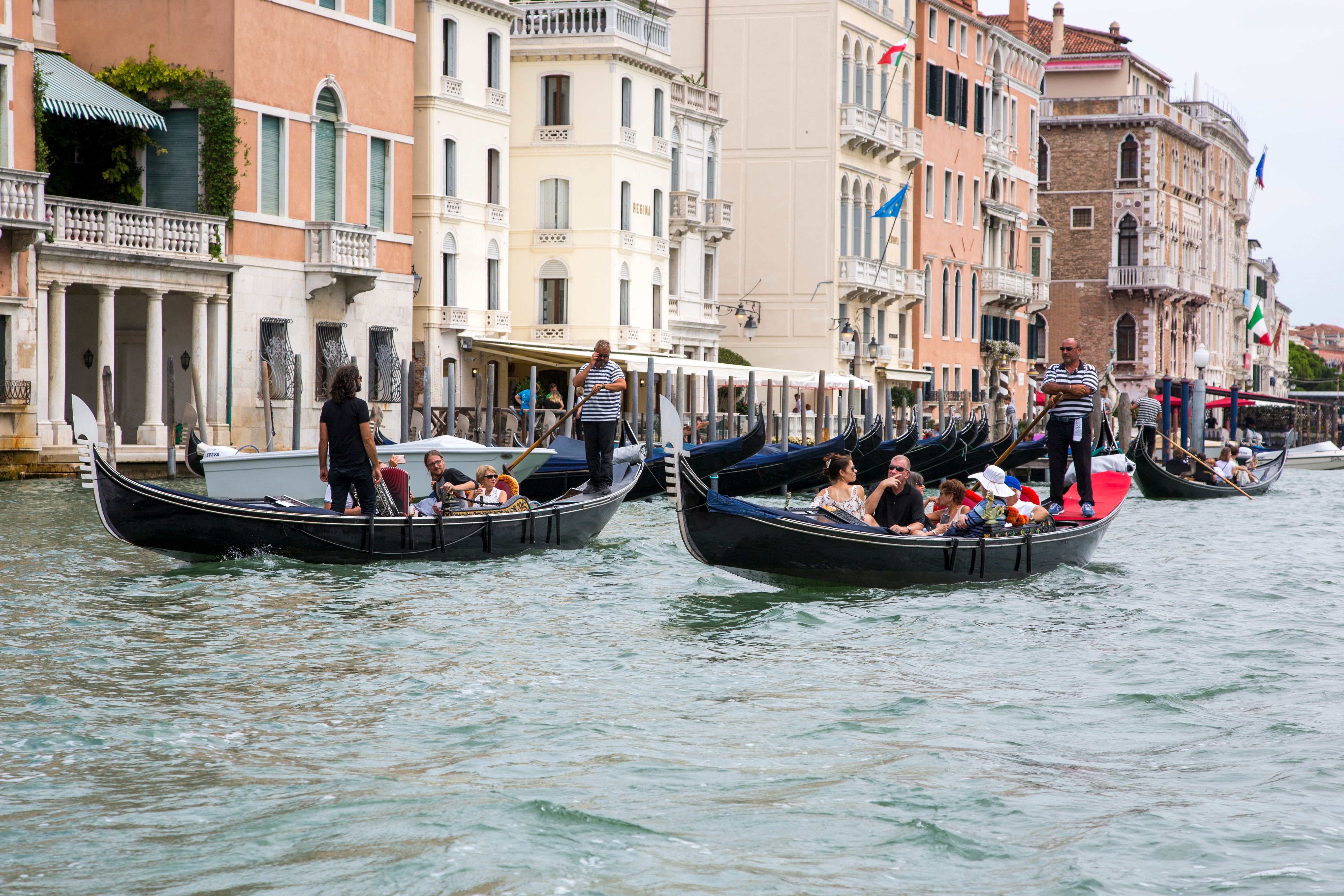 Scenic Gondola Ride on Venice's Grand Canal · Free Stock Photo