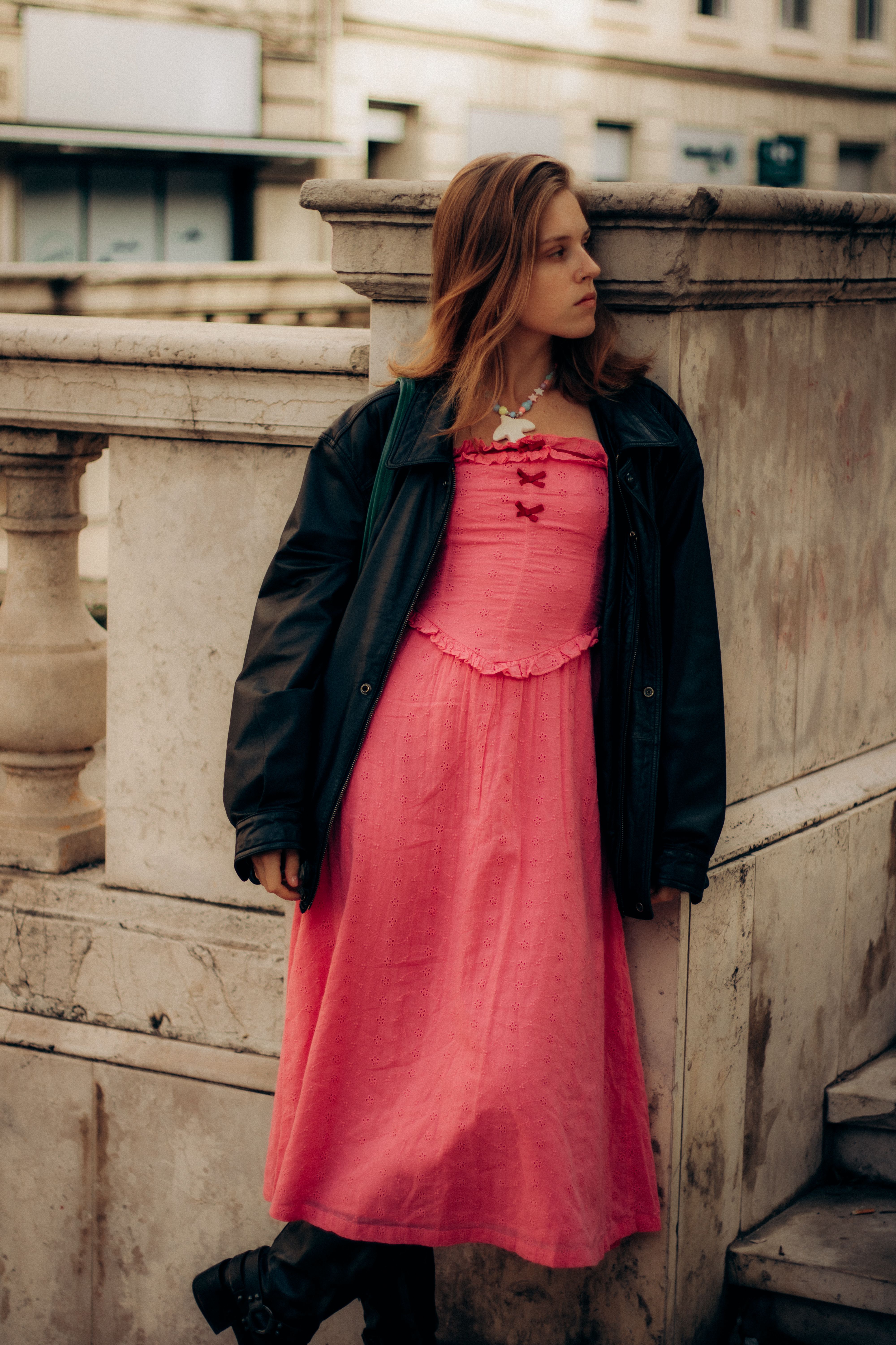 Woman in Pink Dress and Leather Jacket Outdoors · Free Stock Photo