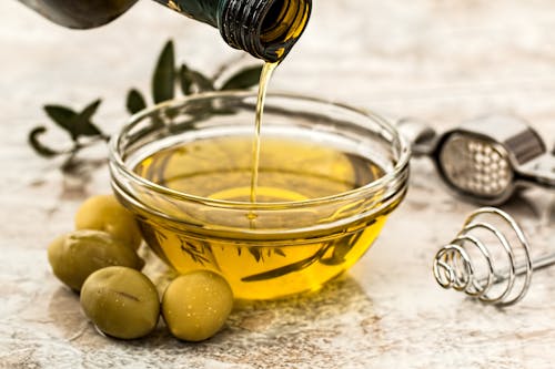 Bowl Being Poured With Olive oil