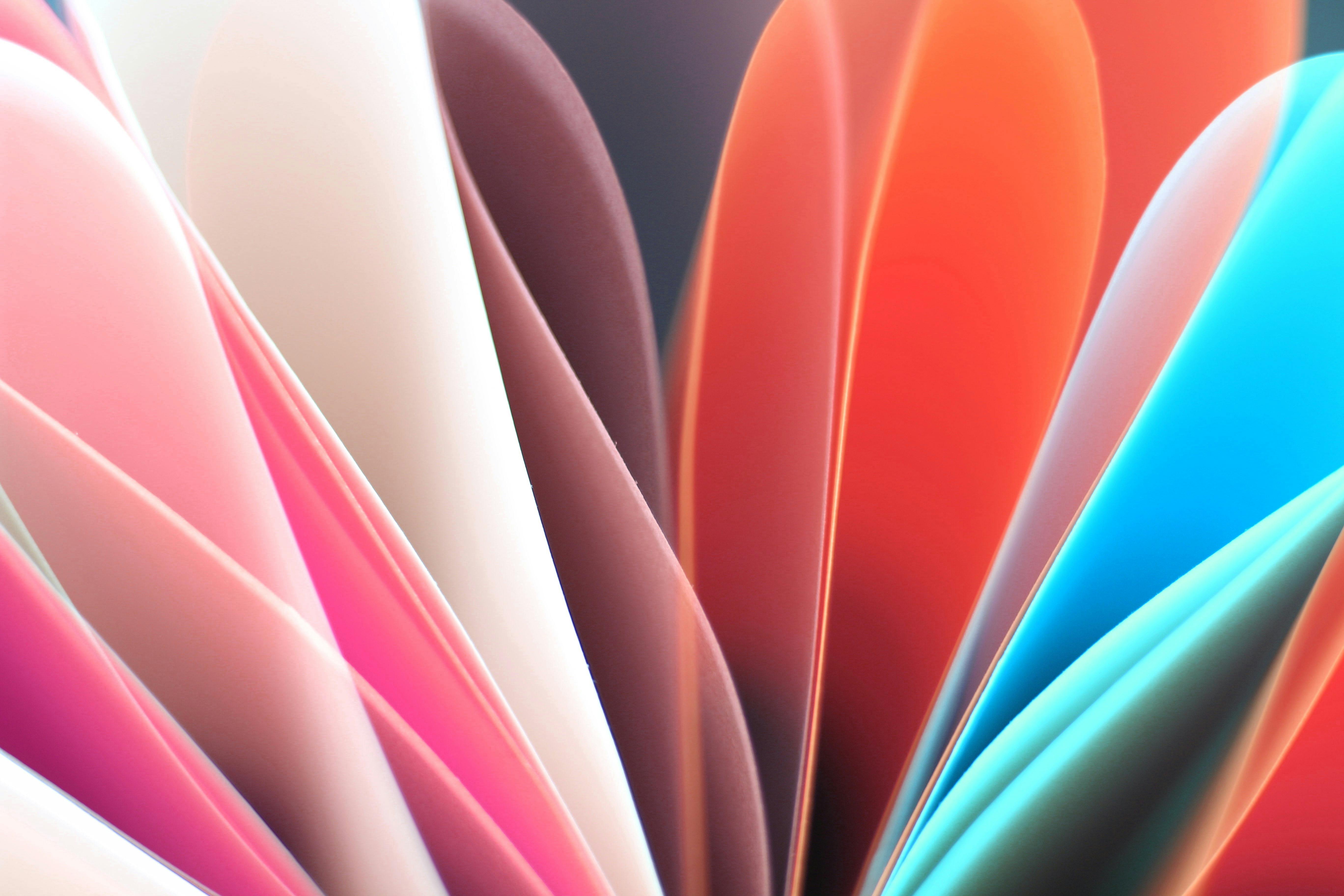 Free Dynamic abstract composition of colorful folded paper sheets with vibrant hues. Stock Photo