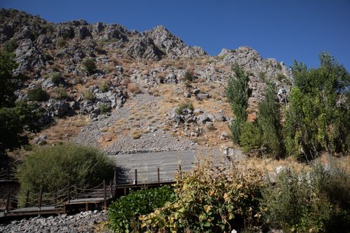 Free Rugged rocky hills with lush greenery in Tunceli, Türkiye, under a clear blue sky. Stock Photo