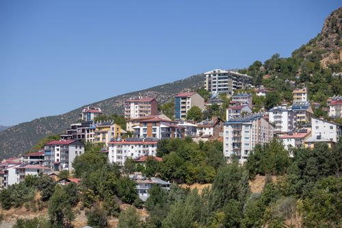 Free A scenic view of residential buildings nestled in the hilly terrain of Tunceli, Türkiye. Stock Photo