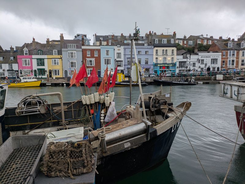 Fishing boats docked at Weymouth Harbour — photo by David Allen on Pexels