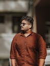 Stylish Young Man in Brown Shirt Outdoors