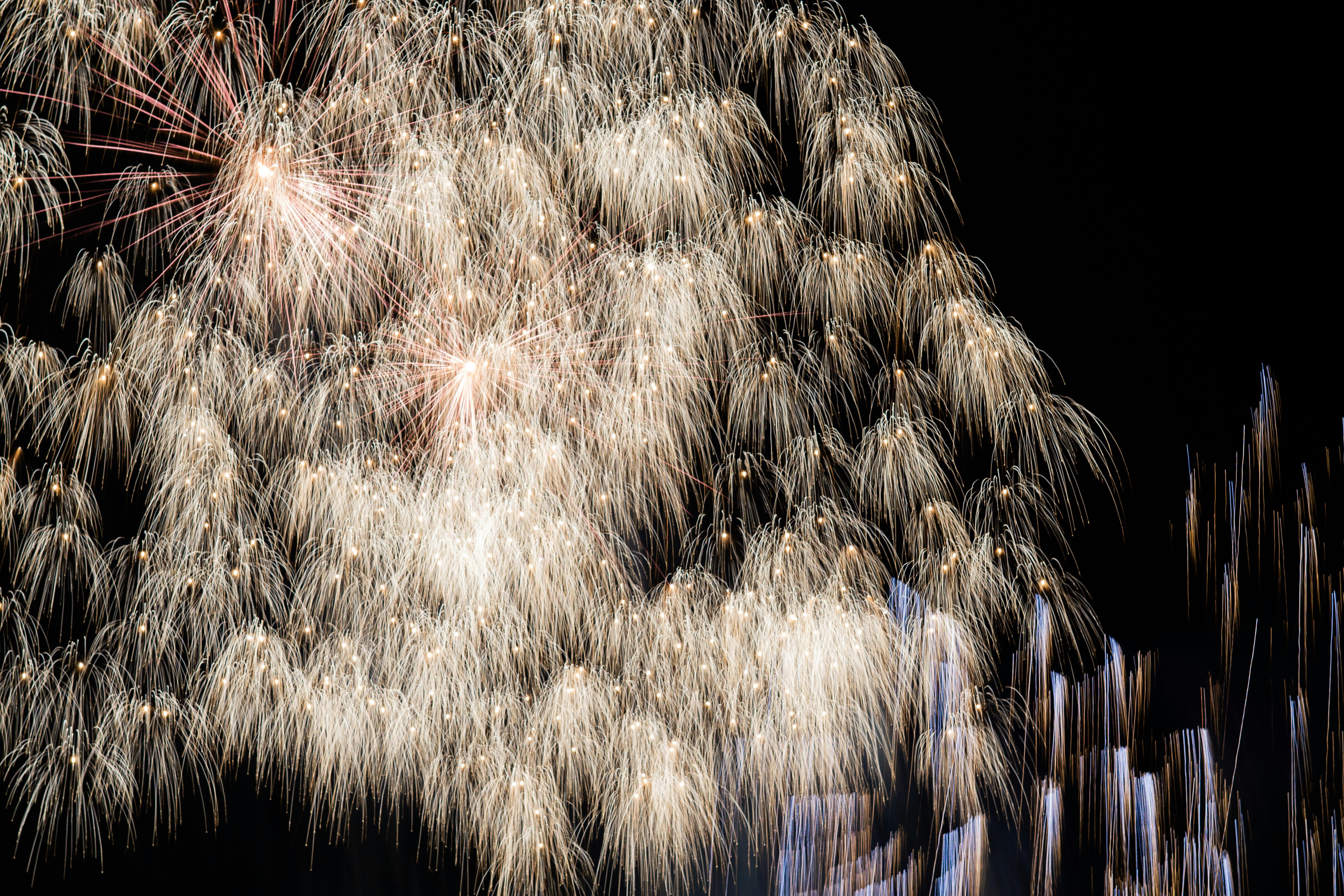 Dazzling display of fireworks illuminating the night sky with vibrant colors and patterns.