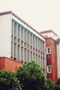 Elegant Red Brick Building with Green Foliage