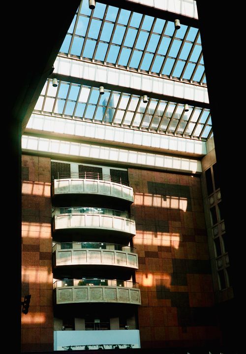 Free Sunlit atrium with contemporary design and glass skylight, captured in Taipei City, Taiwan. Stock Photo