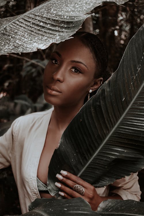 Woman Hiding Behind Banana Leaves