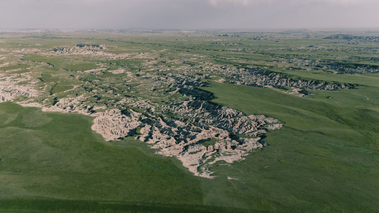Grassland Rocks Aerial View of Expansive Grasslands and Rock Formations · Free Stock Photo
