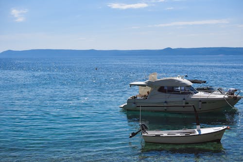 Scenic coastline with vibrant yachts