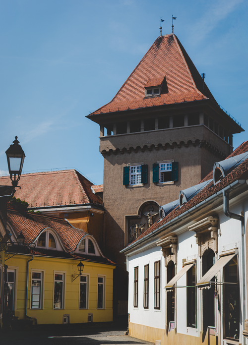 Free Charming historic buildings and a tower in Kőszeg, Hungary capturing medieval architecture. Stock Photo