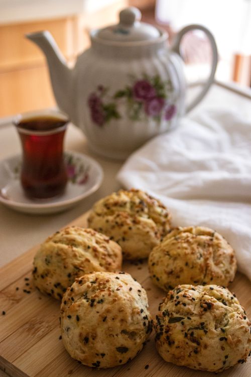 Free Cozy indoor scene of homemade scones and tea for a relaxing afternoon. Stock Photo