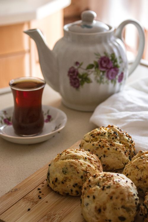 Free Cozy afternoon tea setting with scones and floral teapot. Stock Photo