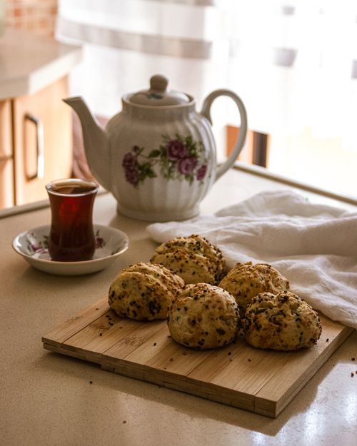 Free Warm kitchen scene with tea and freshly baked scones, ideal for cozy mornings. Stock Photo