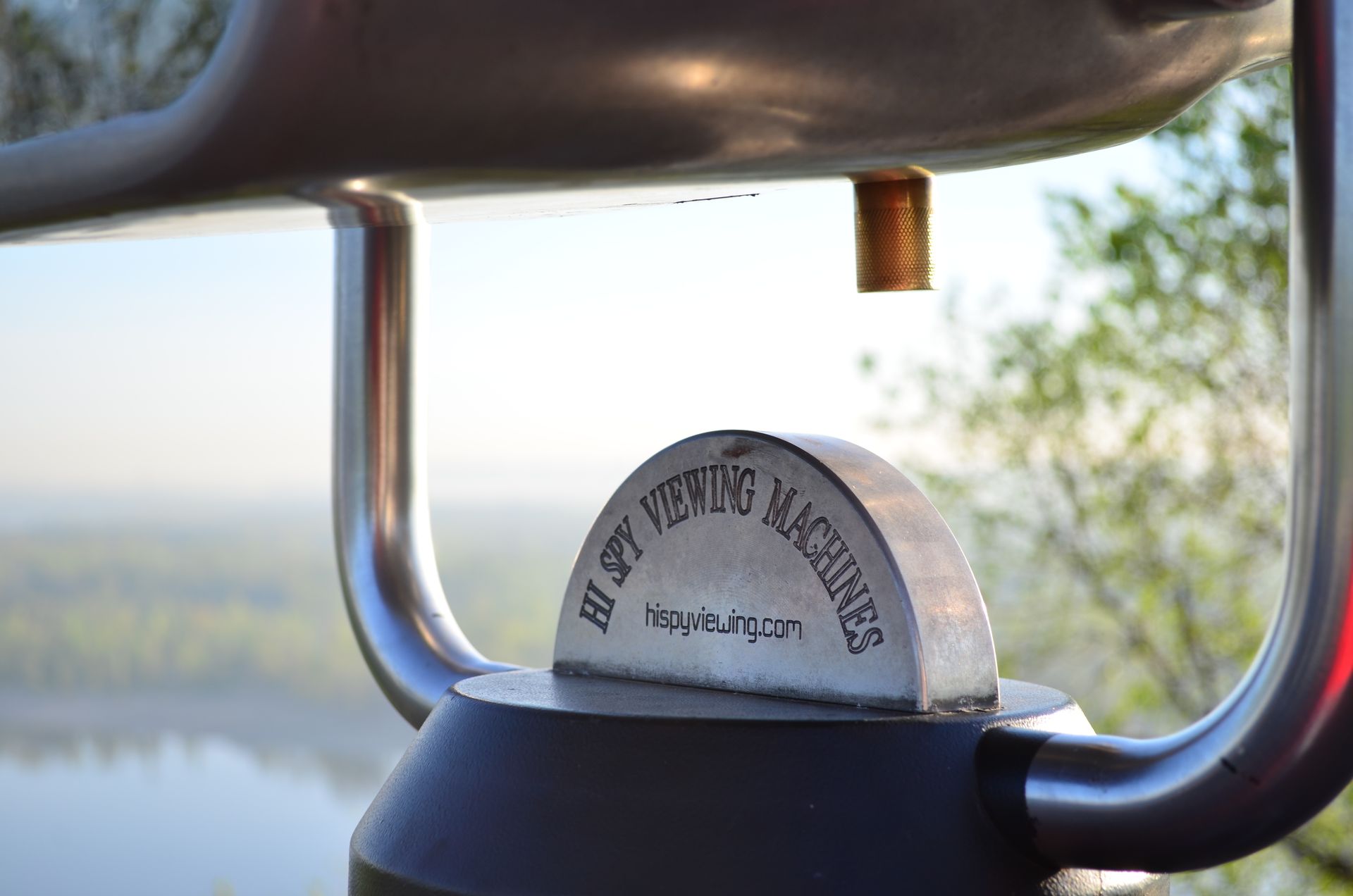 A detailed view of a metal viewing machine in Kyiv, highlighting its chrome finish and engraved details.