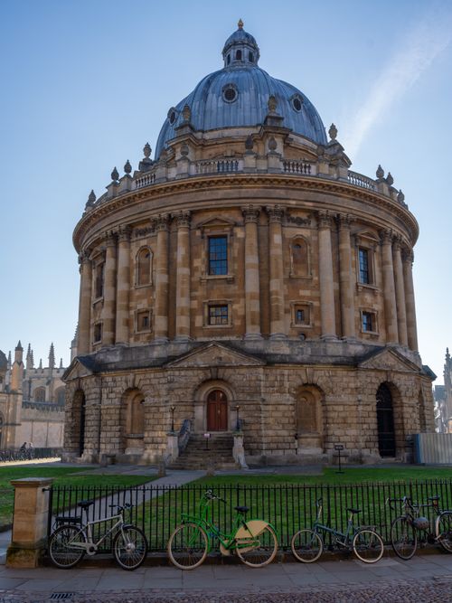 Free A stunning view of the historic Radcliffe Camera in Oxford with bicycles in the foreground. Stock Photo