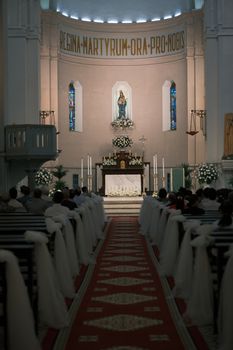 Beautiful wedding ceremony in a historic church with elegant decor.