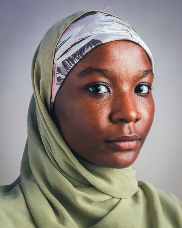 Portrait of a Woman in a Hijab with Neutral Background · Free Stock Photo