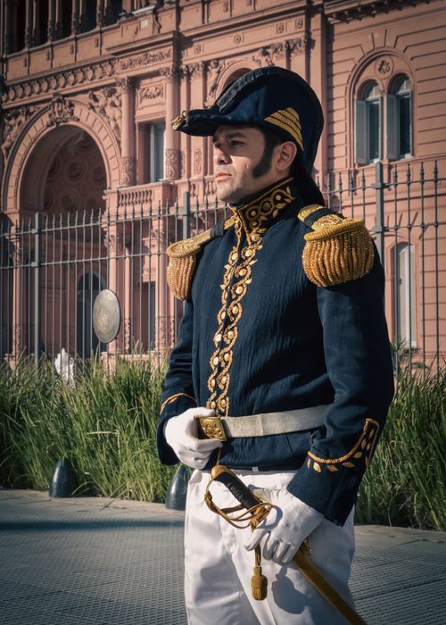 Free A historic guard in traditional uniform stands at Casa Rosada, Buenos Aires. Stock Photo
