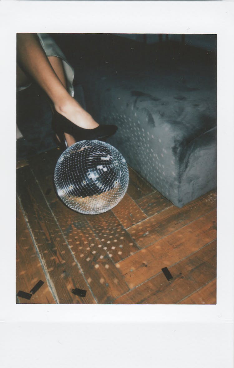 Gray Disco Ball On Brown Wooden Surface