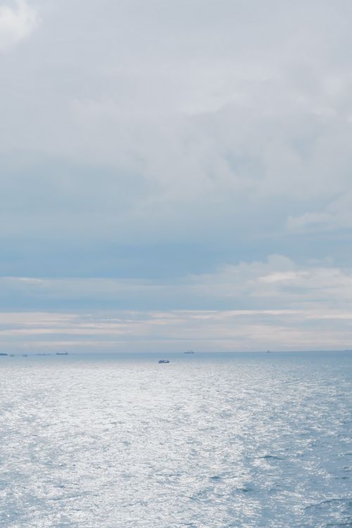 Free Calm and serene seascape at Bà Rịa - Vũng Tàu, Việt Nam, under a cloudy sky. Stock Photo