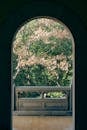 Scenic View Through Arched Temple Window in Nanjing