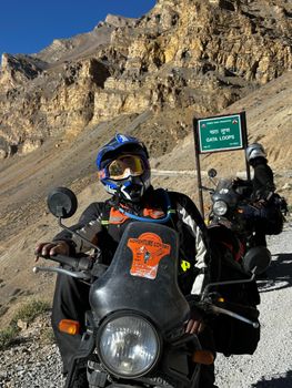 Motorcyclists riding through the scenic Gata Loops in Leh, showcasing adventure travel.
