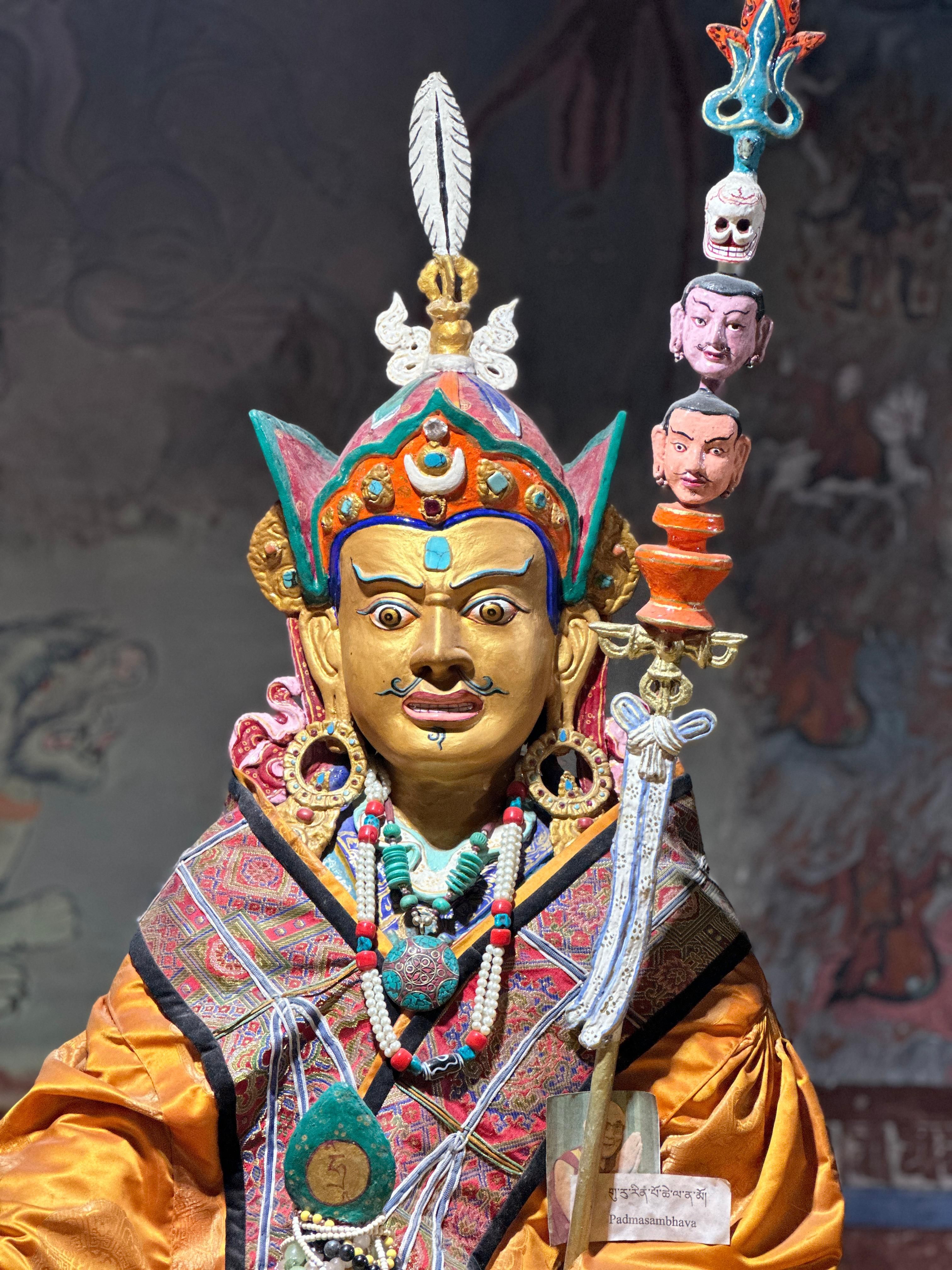 Detailed view of a vibrant traditional statue adorned with intricate patterns in Leh, India.