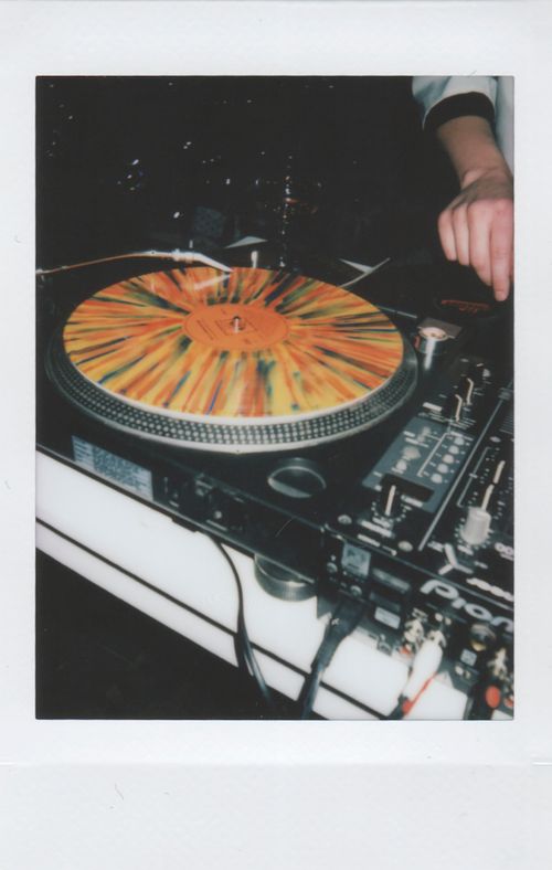 Free Colorful vinyl on a DJ turntable creating lively party vibes indoors. Stock Photo