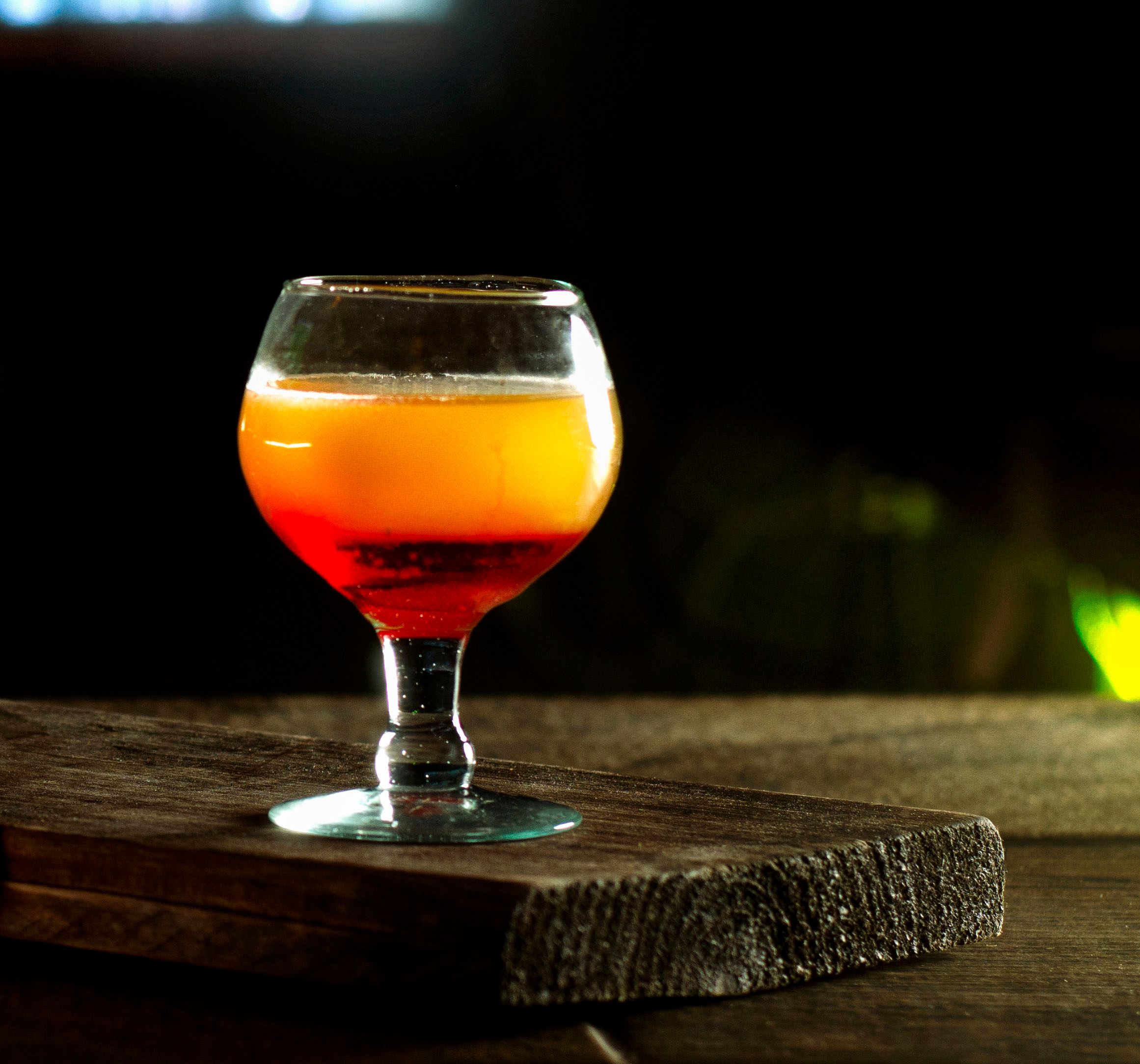 Spritz cocktail with warm golden light in atmospheric bar