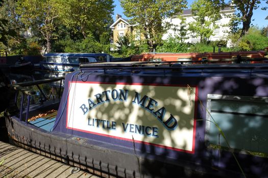 A scenic view of a narrowboat named Barton Mead at Little Venice, London, England.