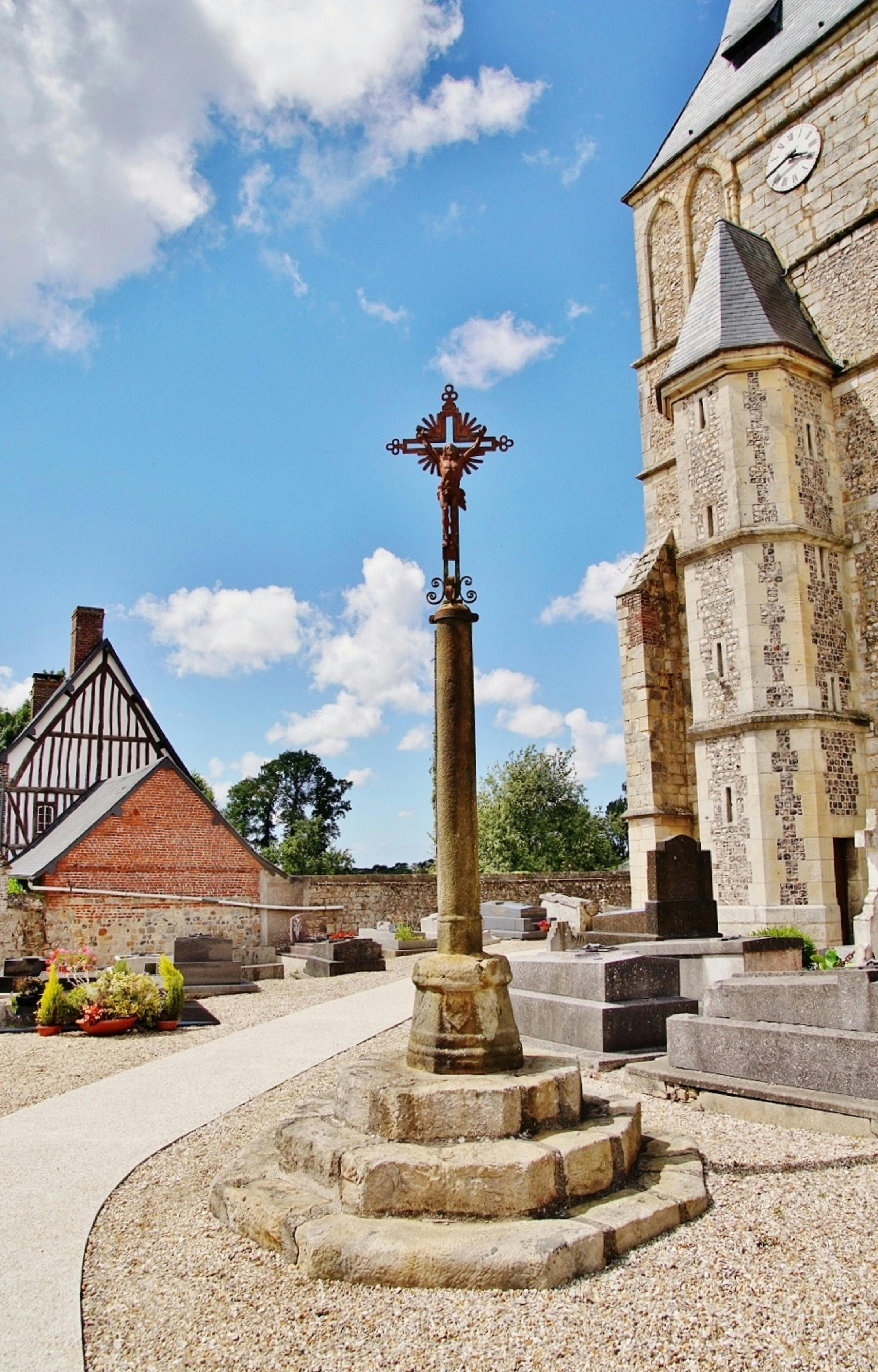 Beautiful churchyard cross and architecture in Sainte-Colombe, France.
