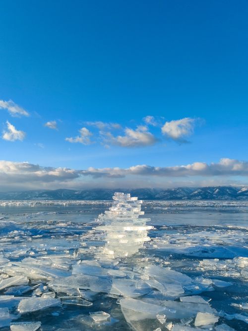 Free Beautiful ice formations with blue skies over Lake Baikal, capturing winter's tranquility. Stock Photo