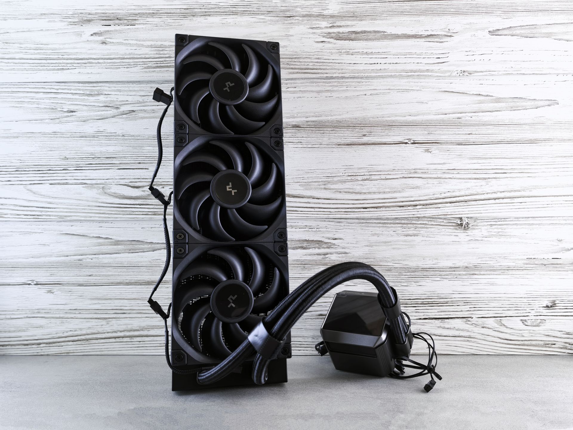 A high-performance cooling fan system for computers displayed on a wooden surface.