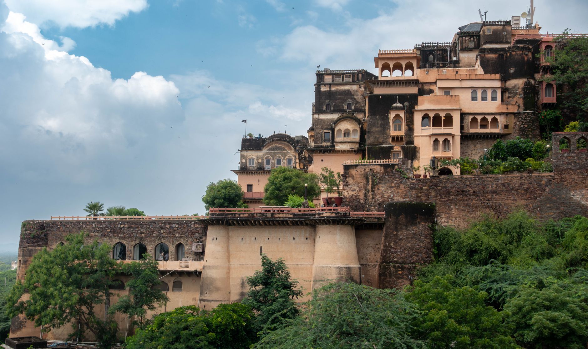 Breathtaking architectural detail of Neemrana Fort-Palace, set against a vibrant sky in Rajasthan, India.