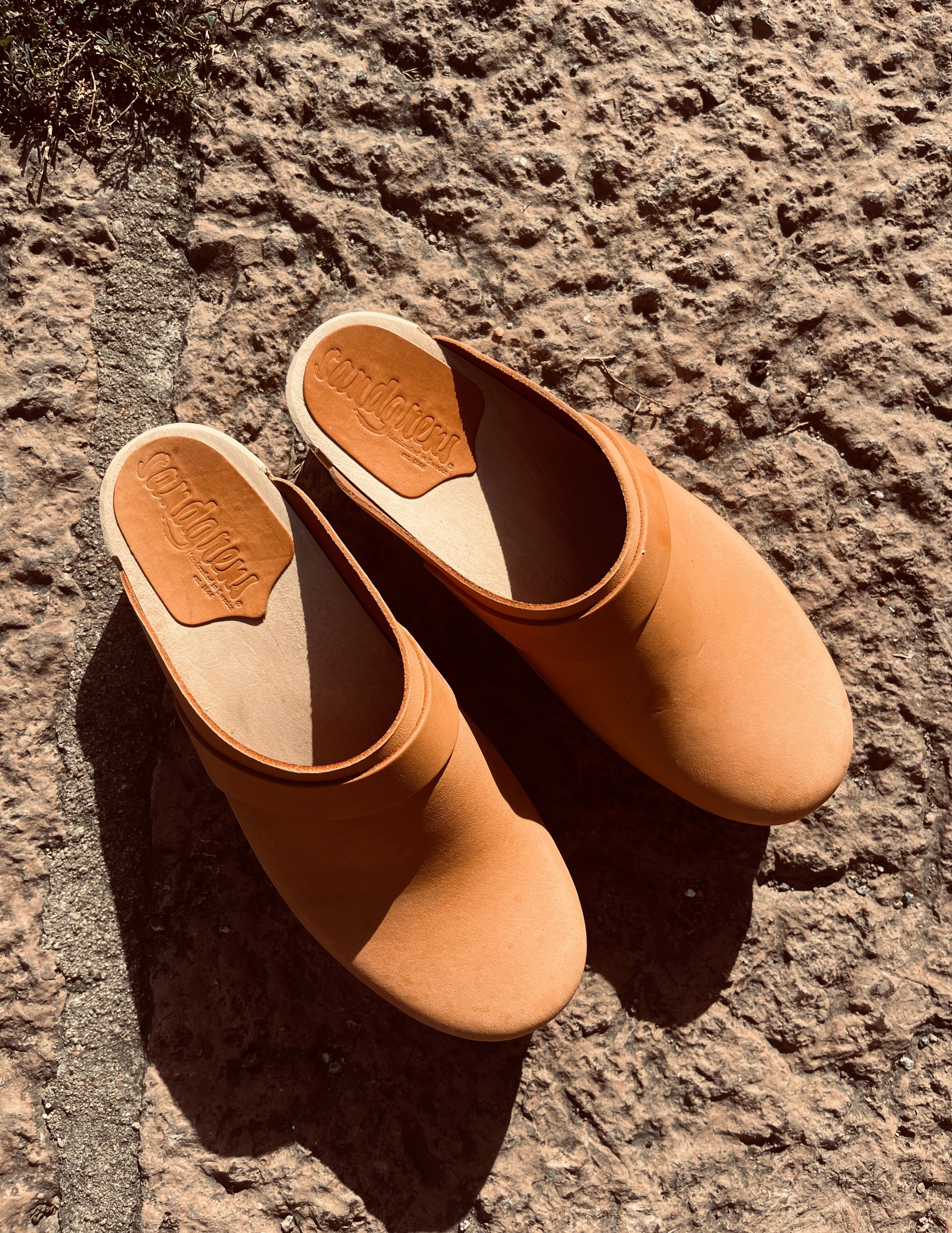 Customer photo of wooden clogs, photo by Martina Cederqvist on Pexels