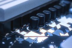 Detailed image of a circuit board featuring capacitors and intricate pathways, ideal for tech-related content.
